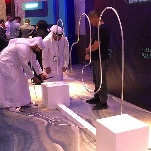 Giant Buzz Wire rental in Dubai with custom branding and wire shape for corporate events, brand activations, and carnival games in the UAE